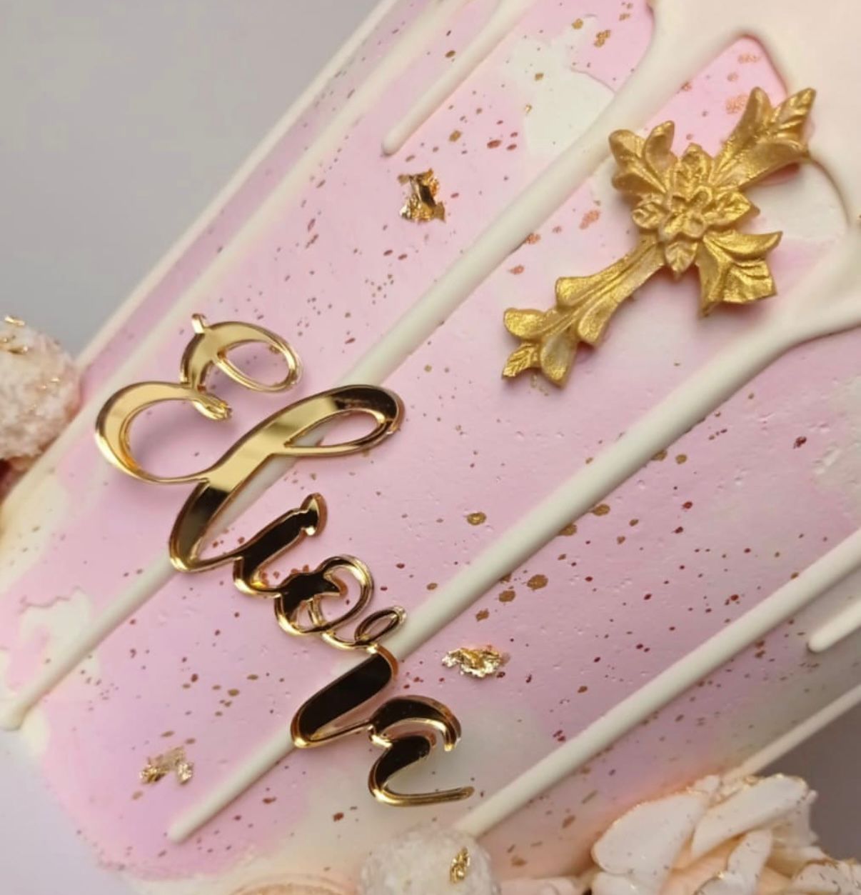 Pink and white christening cake with gold cross and name plaque