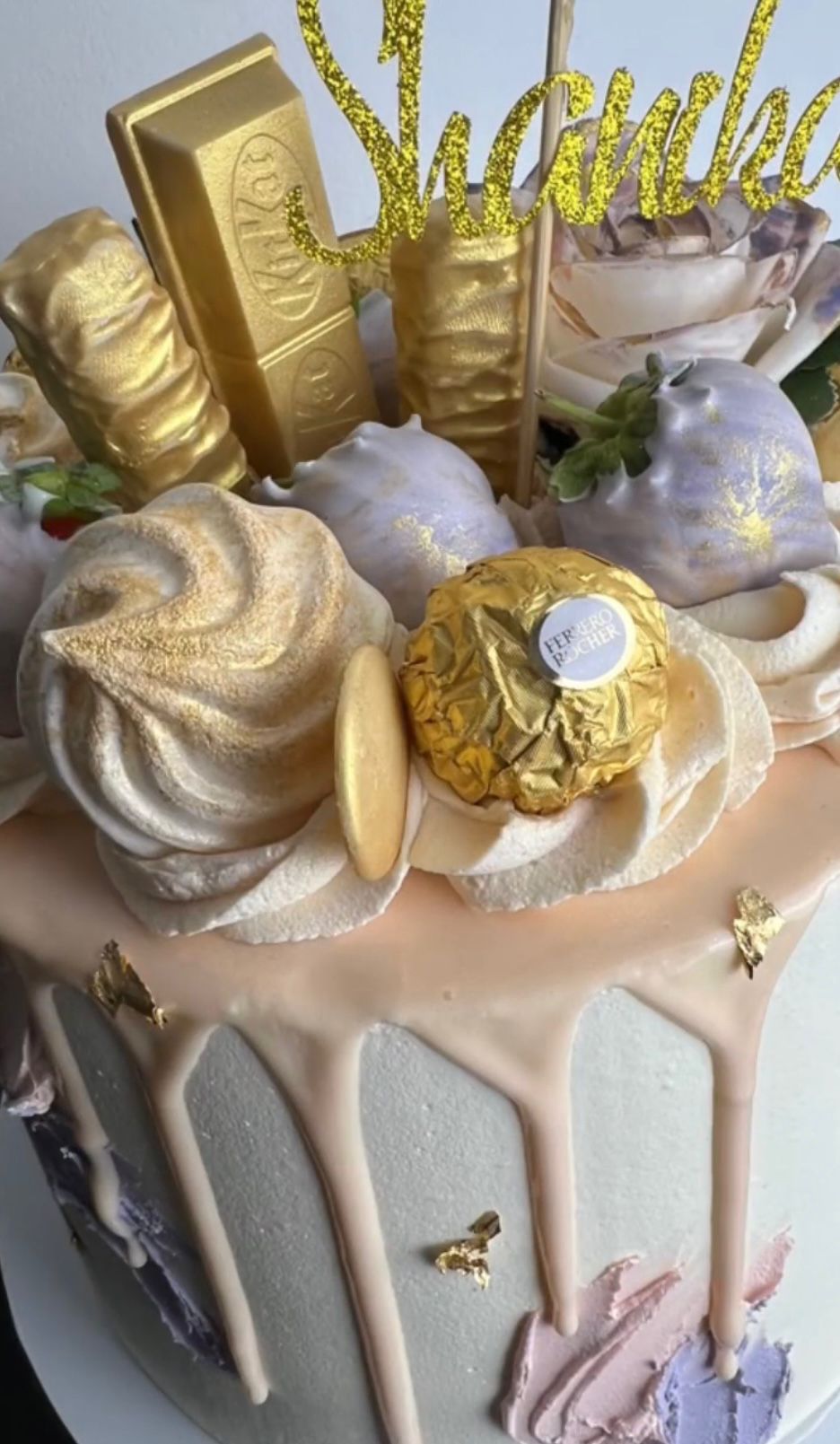 Gold drip celebration cake with meringues and Ferrero Rocher